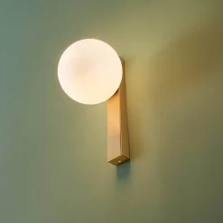 Applique moderne boule en verre et socle fin laiton - Noava