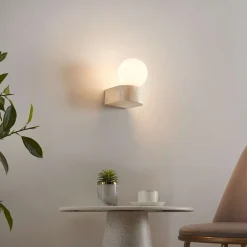 Applique murale sphérique en verre blanc sur socle en pierre - Oriane