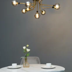 Plafonnier moderne noir et doré 9 boules en verre ambré - Merano